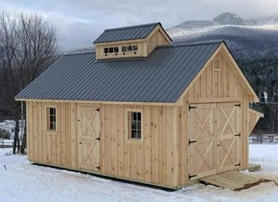 Amish Built Sugar Shack with a black tin roof in the woods