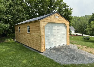 Amish built shed with white garage door